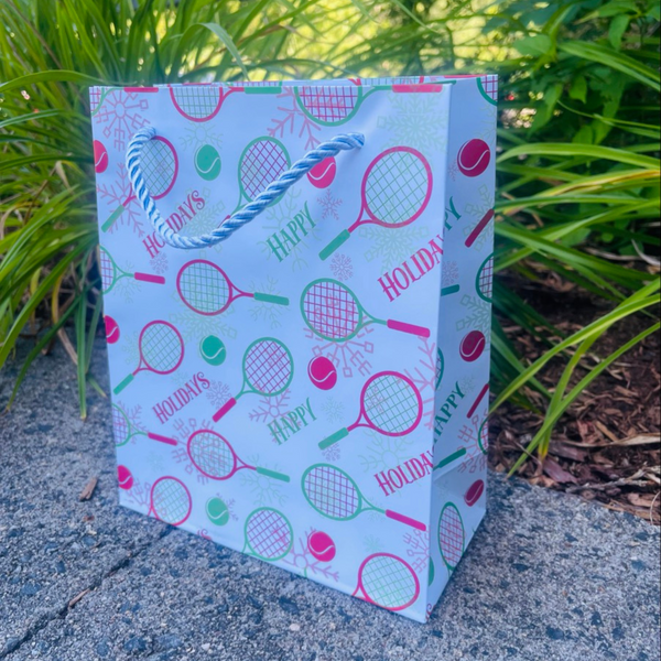 Tennis holiday gift bag with festive racket and ball designs, perfect for tennis lovers and accessories enthusiasts.