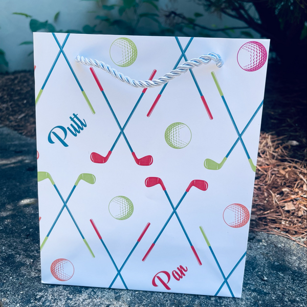 Vibrant golf gift bag featuring colorful golf balls and clubs, ideal for golf lovers and accessories.