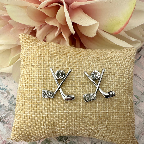 18K gold-plated golf CZ stud earrings with rhinestone accents on decorative pillow, perfect womens golf jewelry.