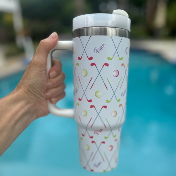 Stainless steel insulated tumbler featuring a fun golf design and sturdy handle.