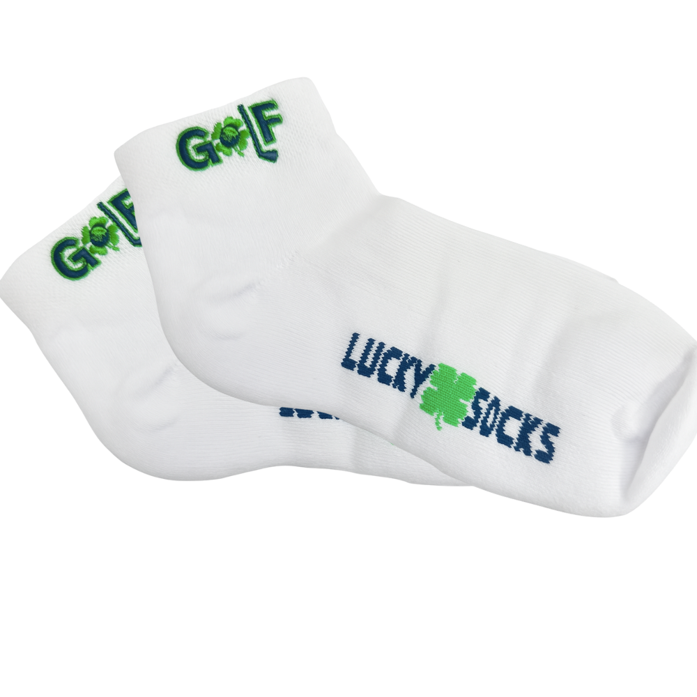 White ankle golf socks with green shamrock embroidery reading “LUCKY SOCKS” and “GOLF”
