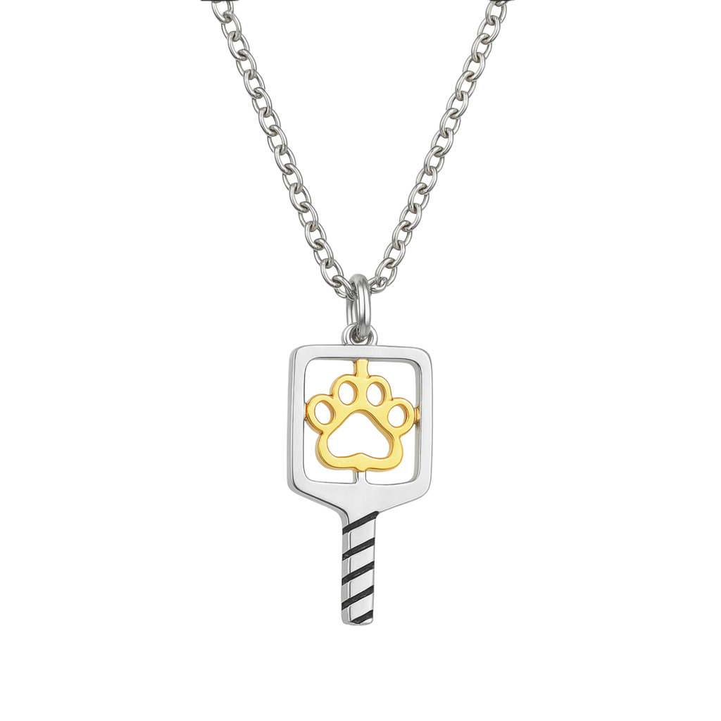 Silver pickleball paddle necklace pendant with a gold paw print design and black-striped handle on a silver chain, perfect jewelry gift for pickleball players and pet lovers
