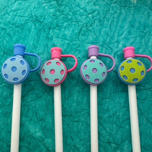 Colorful pickleball straw covers in blue, pink, and green for fun, clean drinking accessories. Perfect pickleball gifts.